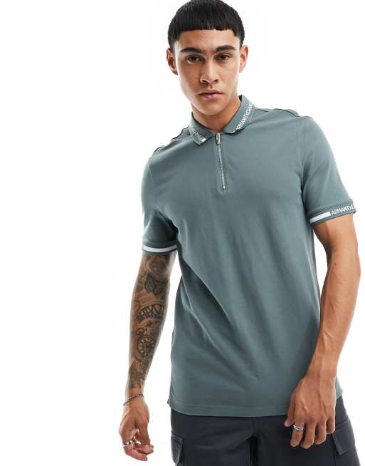 Armani Exchange – Pikee-Polohemd in Grün mit Logo, Reißverschluss und Zierstreifen an Kragen und Bündchen