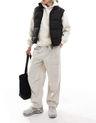 Armani Exchange – Pufferweste in Schwarz mit Logo