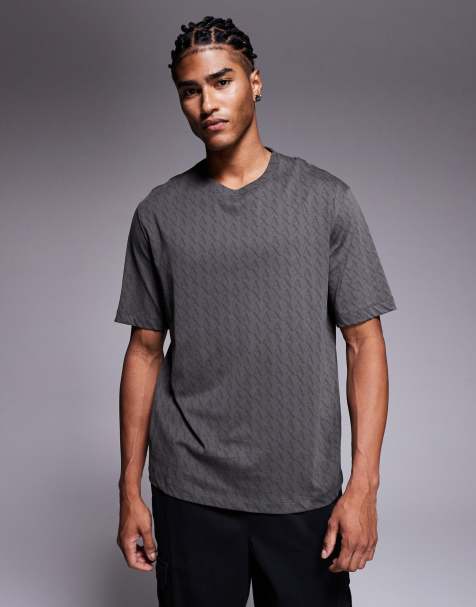 Armani Exchange – T-Shirt in Grün mit Logomuster - view 1