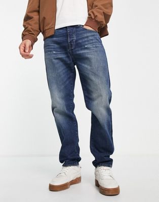 Armani Exchange tapered jeans in mid wash blue