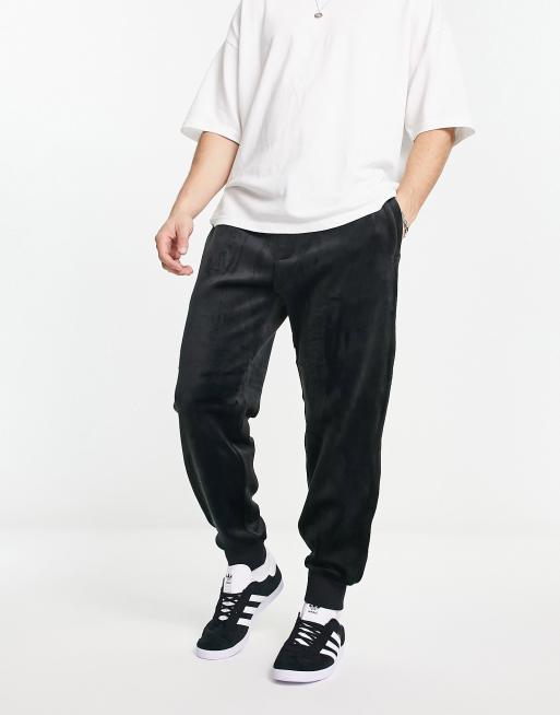 Armani Exchange velour trackies in black | ASOS