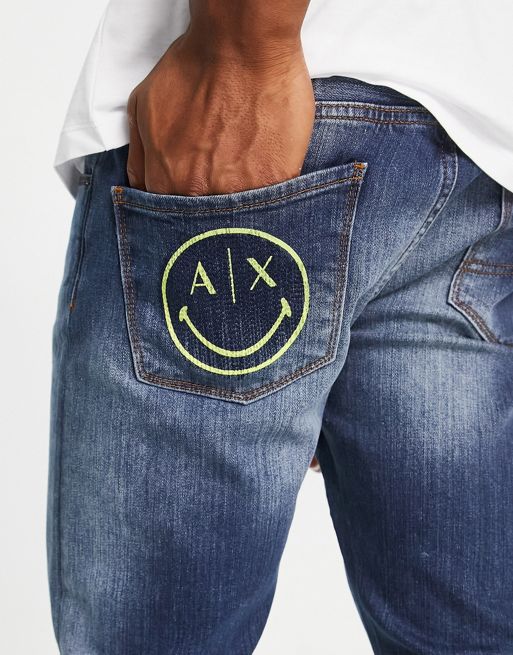 Armani Exchange x Smiley Face skinny leg jeans in mid wash blue | ASOS