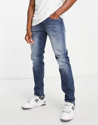Armani Exchange x Smiley Face skinny leg jeans in mid wash blue