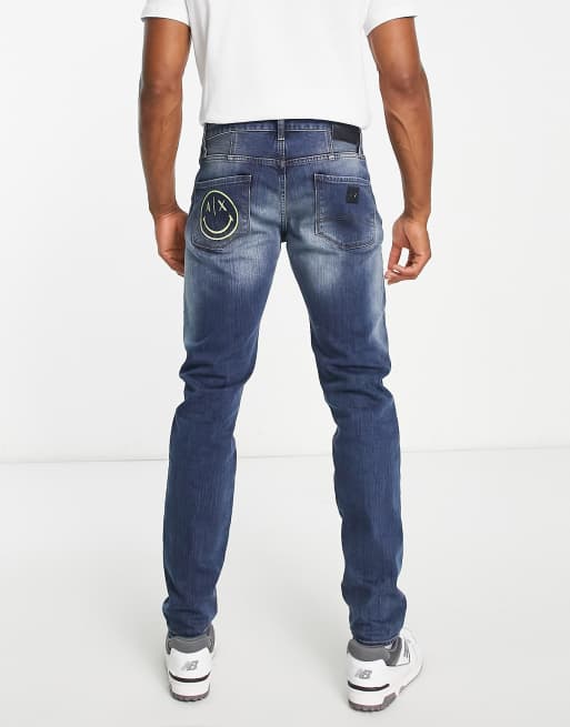 Armani Exchange x Smiley Face skinny leg jeans in mid wash blue | ASOS