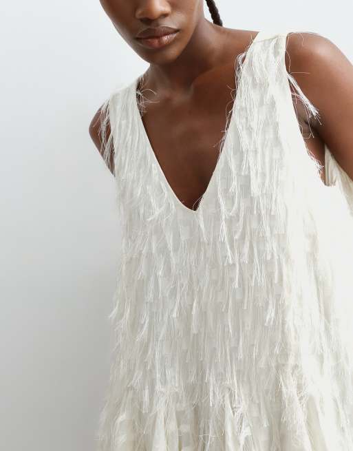 ARRANGE all over fringe longline peplum top in ivory, 5 of 5