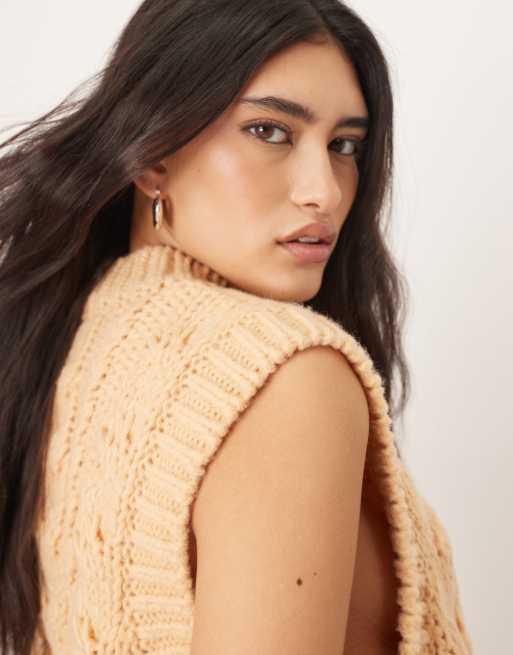 ARRANGE cable knit sleeveless sweater with tie detail in apricot