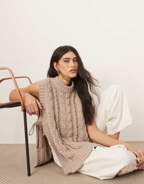 ARRANGE cable knit sleeveless sweater with tie detail in oatmeal - view 1
