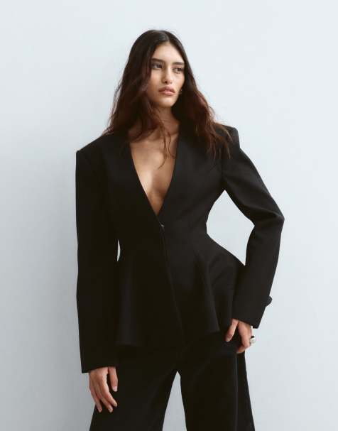 ARRANGE collarless strong shoulder peplum blazer in black - view 1