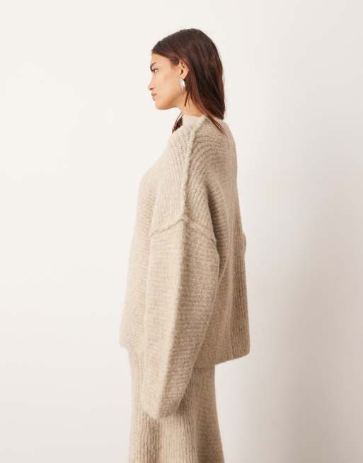 ARRANGE contrast stitch knit exposed seam sweater in taupe - part of a set