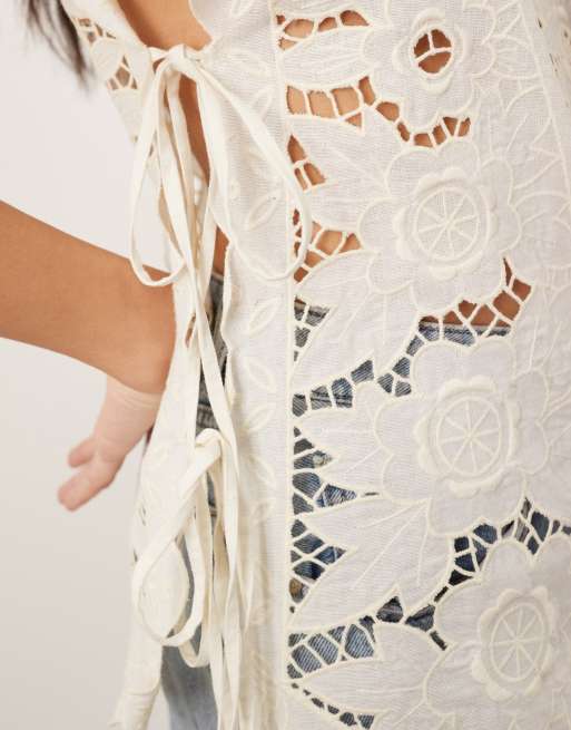 ARRANGE cotton cutwork embroidered top with tie side in off white