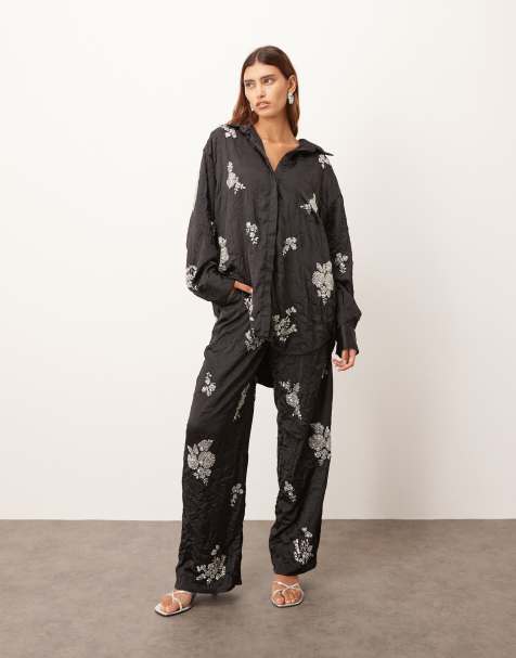 ARRANGE crinkle satin floral embellished shirt and pants in black - view 1