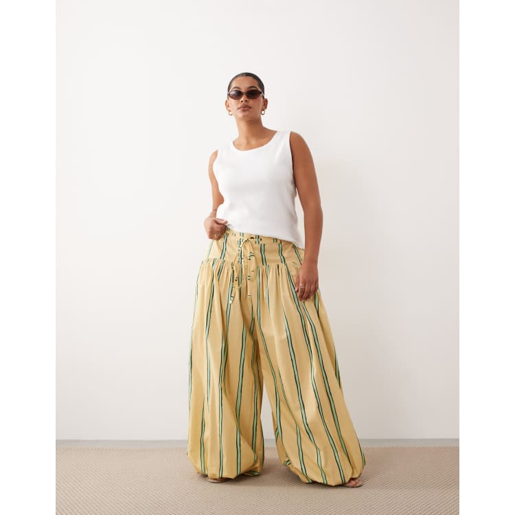 ARRANGE Curve balloon pants with tie waist in yellow stripe | ASOS