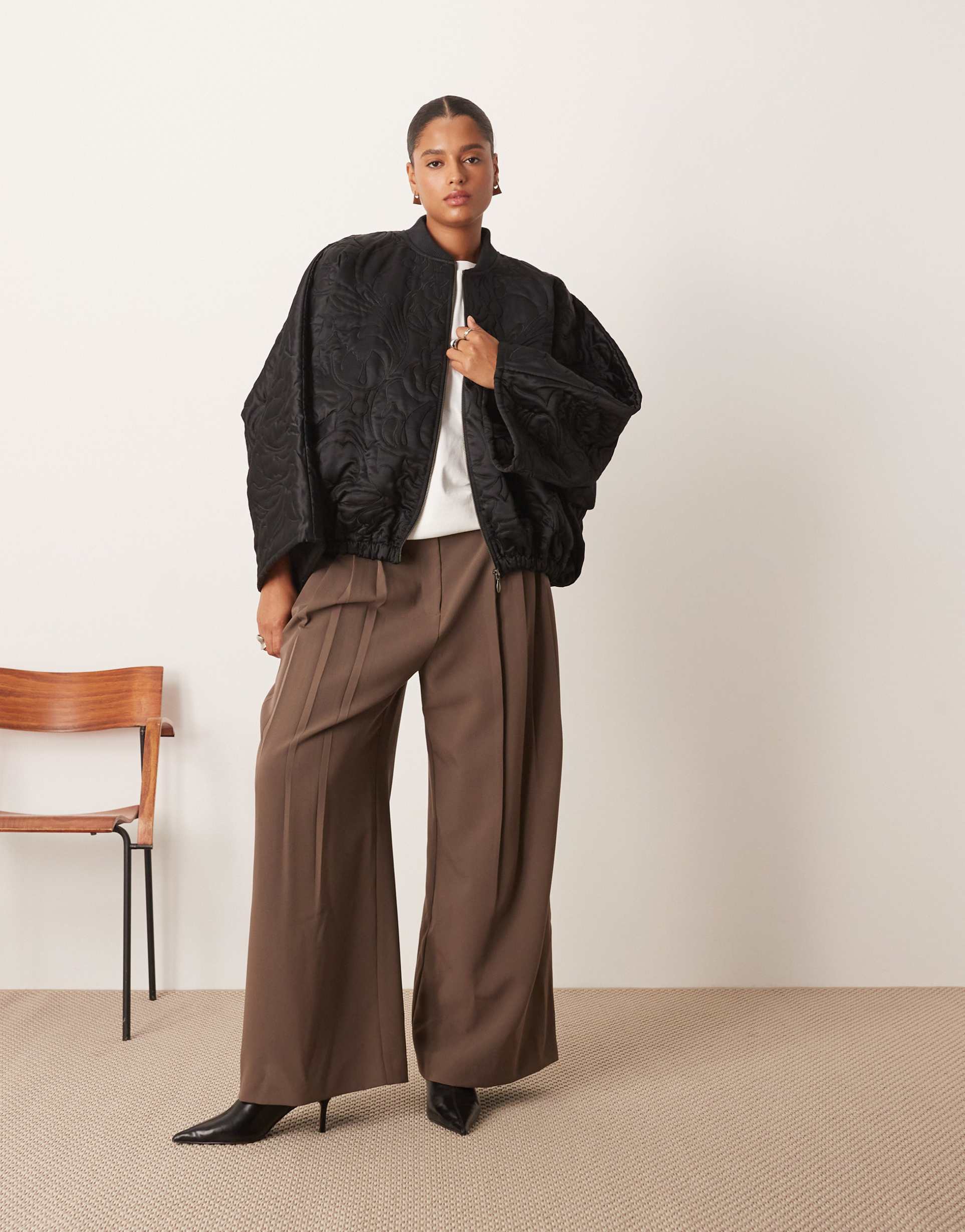 arrange curve floral quilted bomber jacket in black