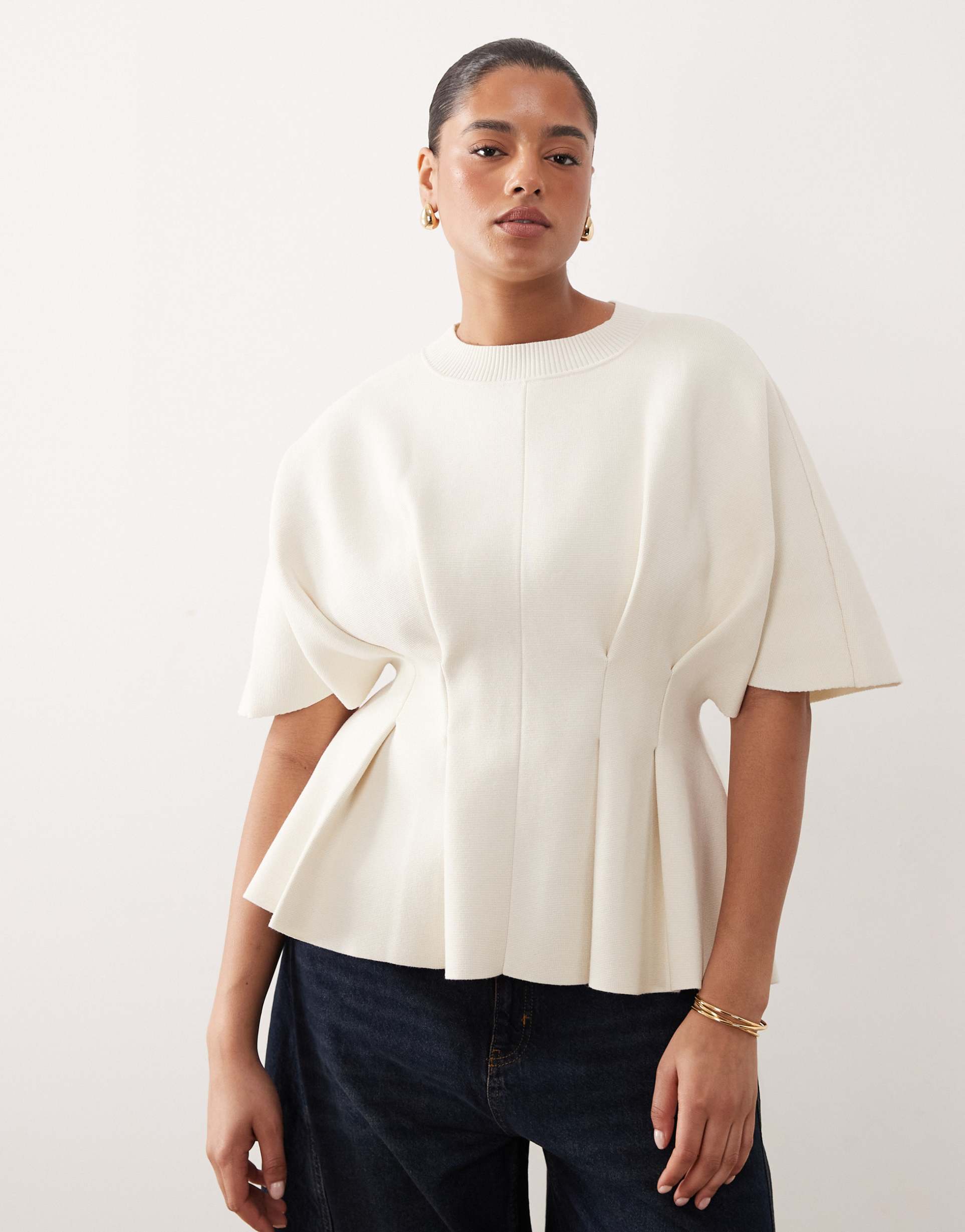 arrange curve knit short sleeve pleated top in oyster