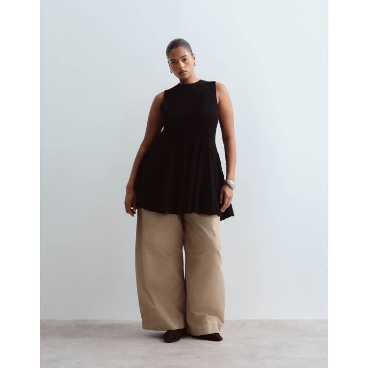 ARRANGE Curve knit sleeveless peplum top in black | ASOS