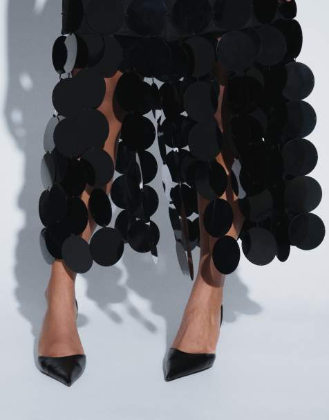 ARRANGE Curve midi-rok met schijfjeslovertjes in zwart - view 1