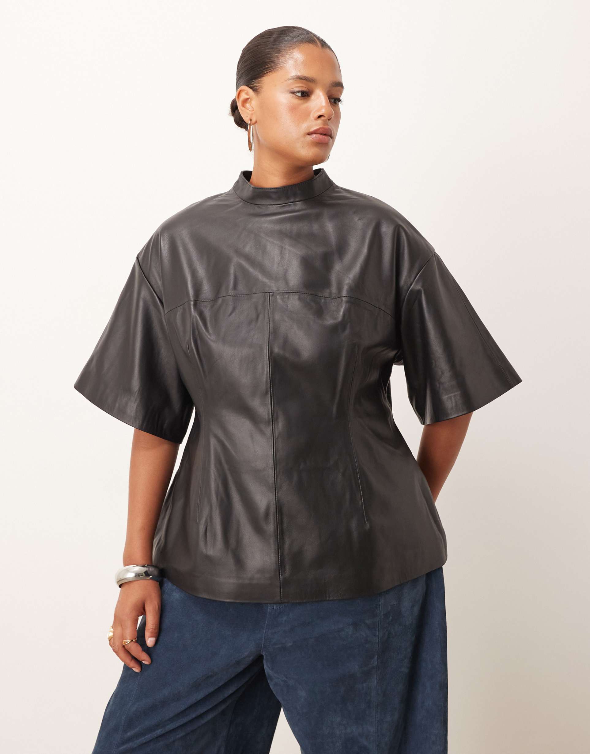 arrange curve soft leather high neck top with nipped-in waist in black