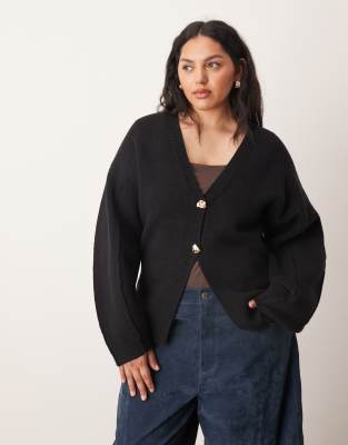 ARRANGE Curve - Strickjacke in Schwarz mit ovalen Ärmeln und geformter Taille