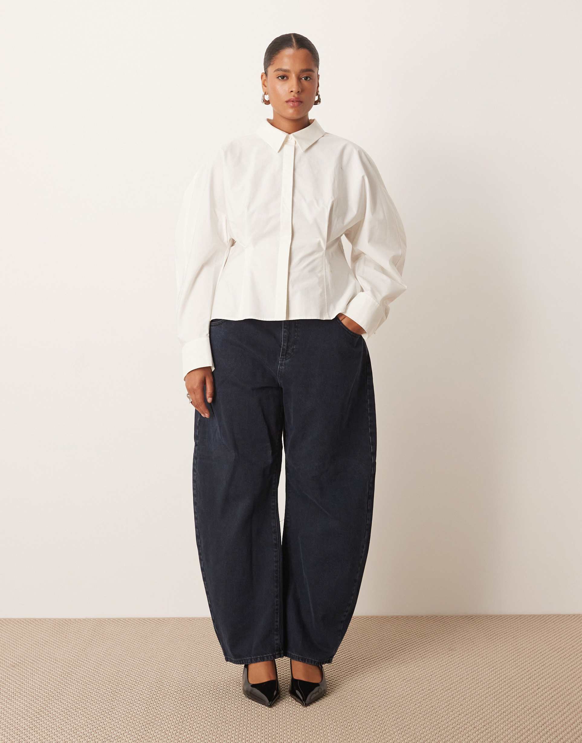 arrange curve tova tapered curved leg jean with roll hem in blue black