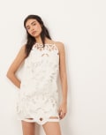 [ARRANGE] ARRANGE floral cut work halterneck mini dress with contrast stitch in white 8 White