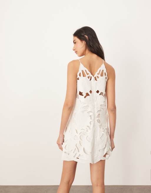 ARRANGE floral cutwork halterneck mini dress with contrast stitch in white