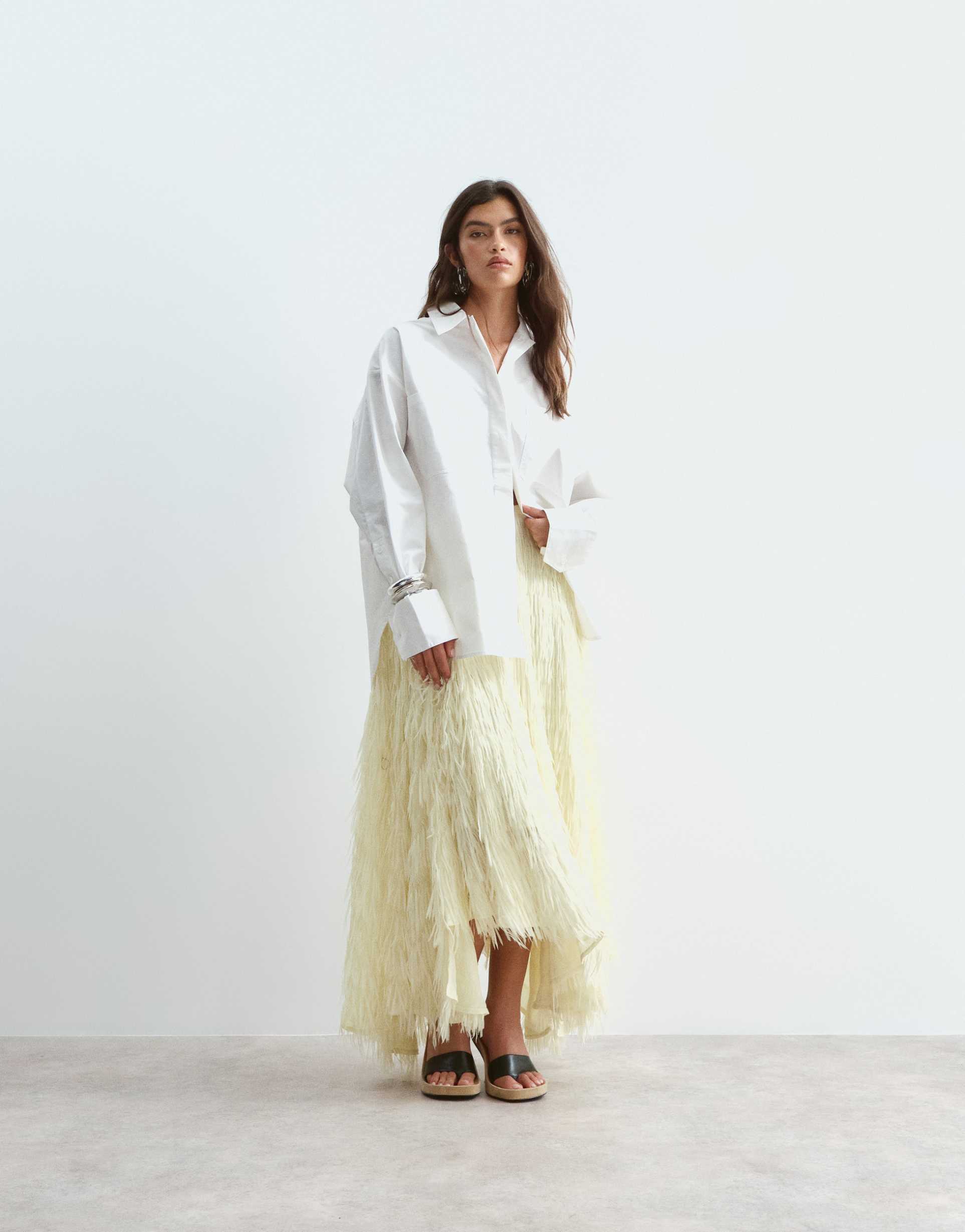 arrange fringe texture asymmetric maxi skirt in soft yellow