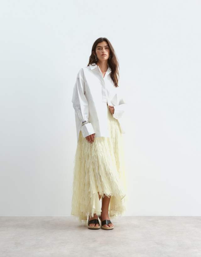 ARRANGE fringe texture asymmetric maxi skirt in soft yellow | ASOS
