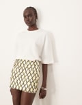 [ARRANGE] ARRANGE geometric grid embellished mini skirt in white-Multi 6 Green and white