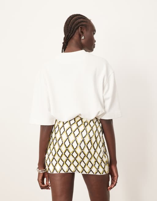 ARRANGE geometric grid embellished mini skirt in white