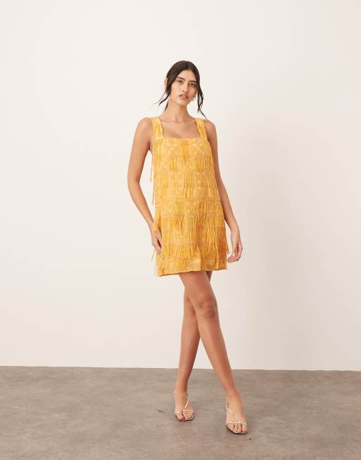 ARRANGE grid embellished square neck shift mini dress with fringe in orange
