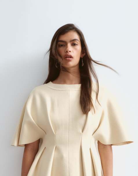 ARRANGE knit short sleeve cinched pleated top in buttermilk - view 1