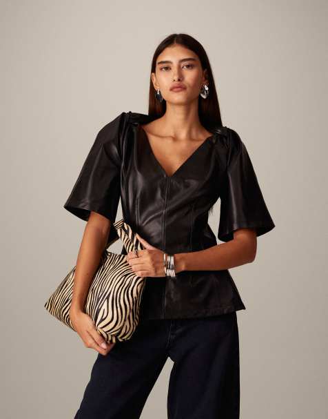 ARRANGE leather twist shoulder top in black - view 1