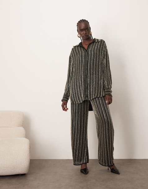 ARRANGE linear beaded oversized shirt and pants set in black - view 1