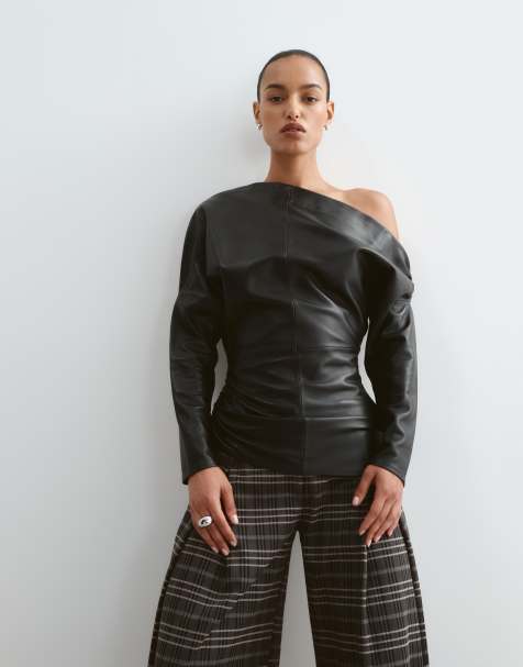 ARRANGE off shoulder ruched waist leather top in black