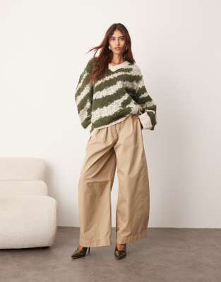 Arrange Oversized Knit V-neck Sweater With Curved Hem In Multi