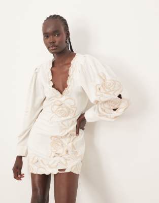 ARRANGE placed floral cut work volume sleeve mini dress in white