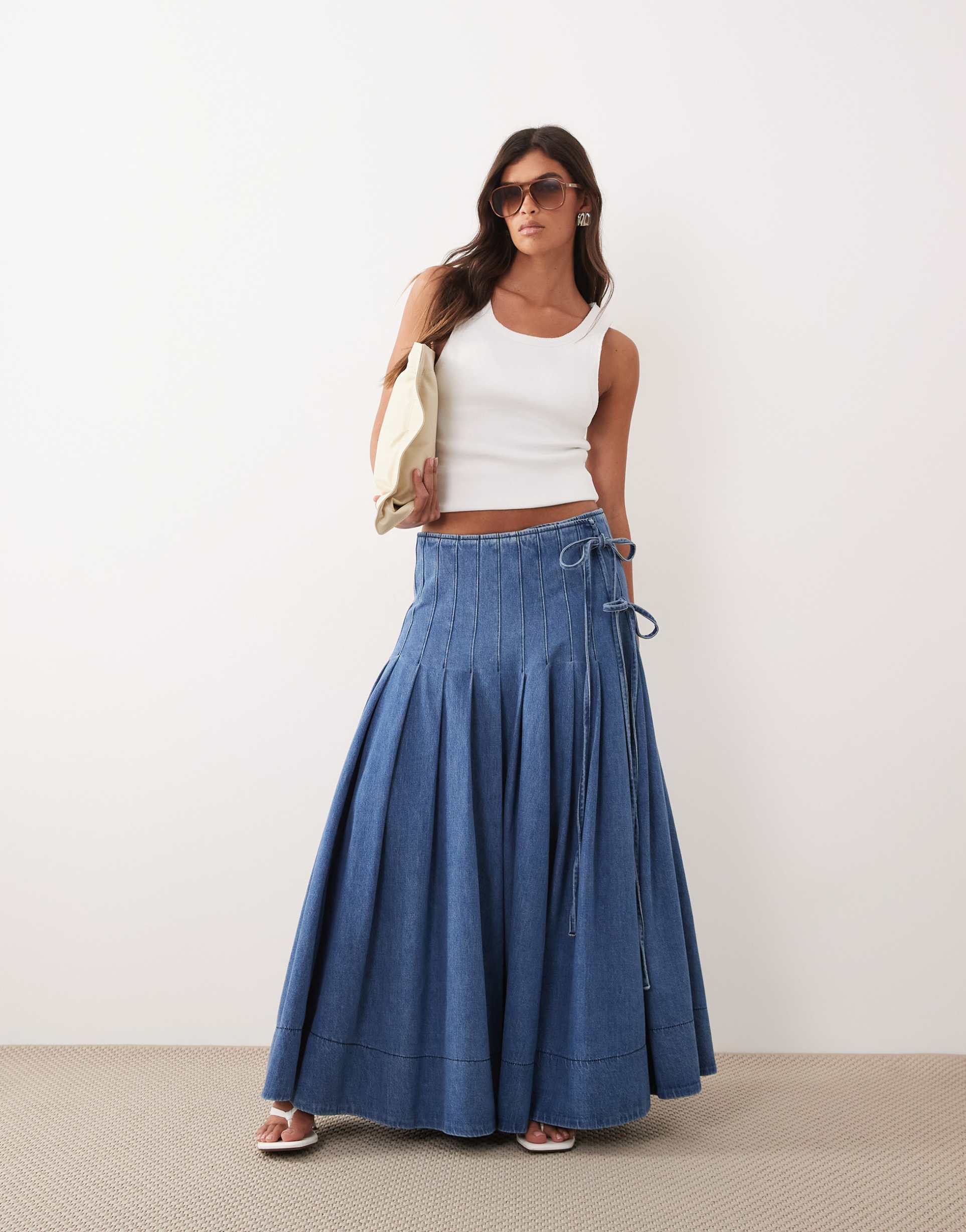 arrange pleated denim midi skirt with tie detail in blue