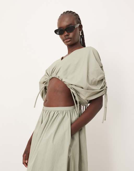 ARRANGE plunge top with ruche detail and drop waist skirt in sage