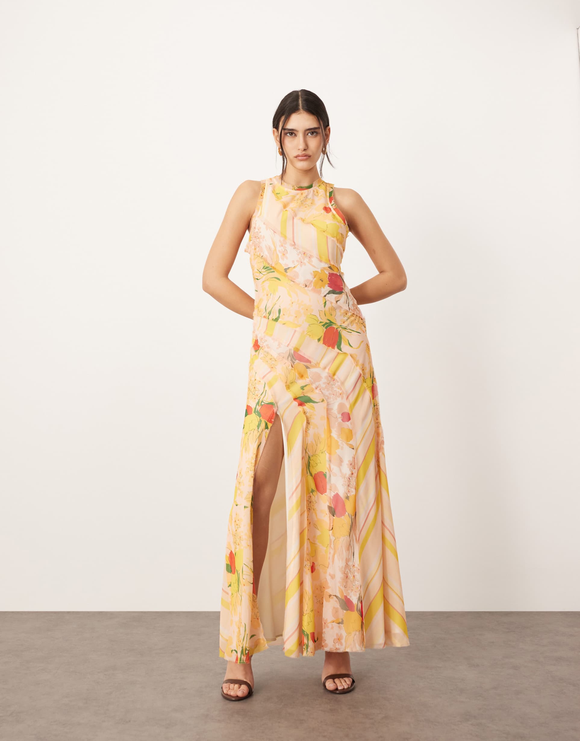 arrange racer neck raw edge paneled maxi dress in peach floral print