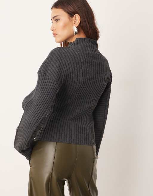 ARRANGE rib knit high neck layered sweater in charcoal