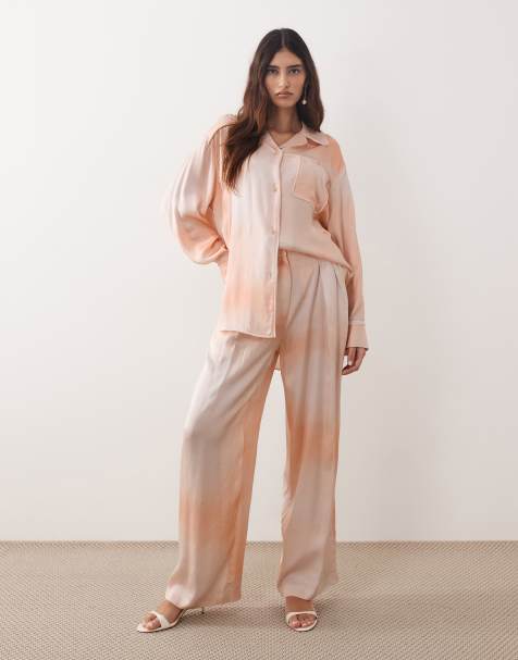ARRANGE satin wide leg pants in light orange - part of a set - view 1
