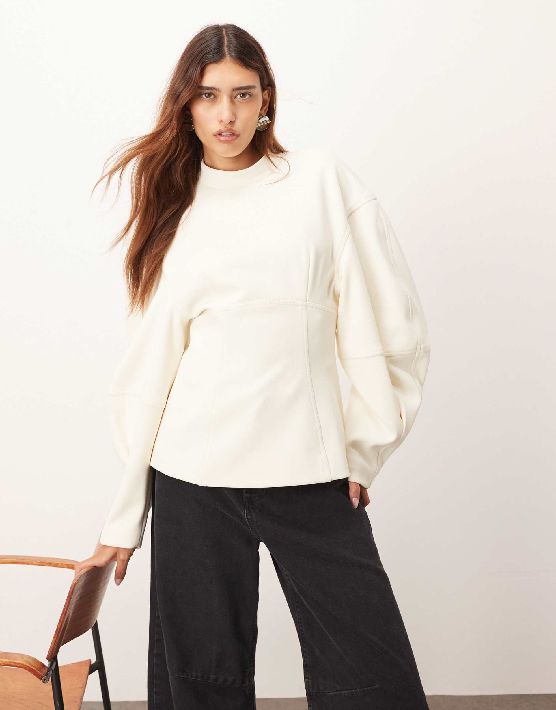 arrange sculpted top with contrast stitching in white