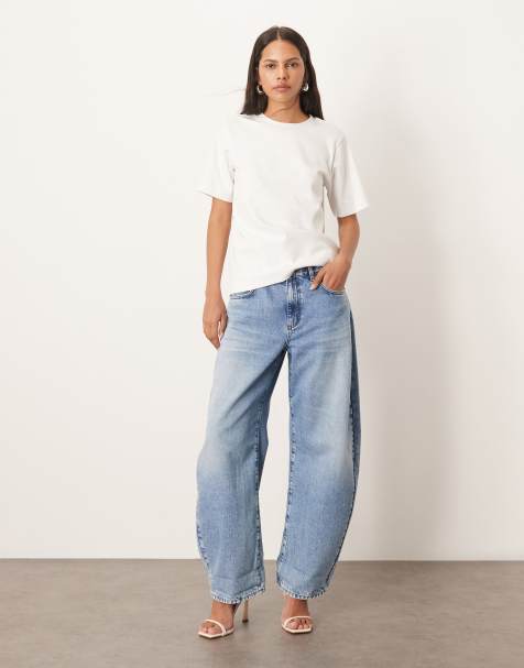ARRANGE Tova tapered curved leg jeans with cuffed hem in light wash - view 1