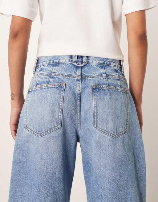 【WOOHWA】STRING CURVED JEAN ARRANGE Tova tapered curved leg jeans with cuffed hem in