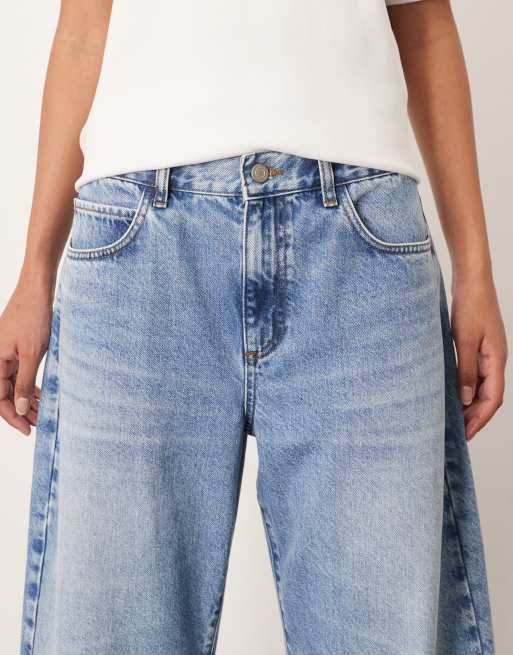 【WOOHWA】STRING CURVED JEAN ARRANGE Tova tapered curved leg jeans with cuffed hem in