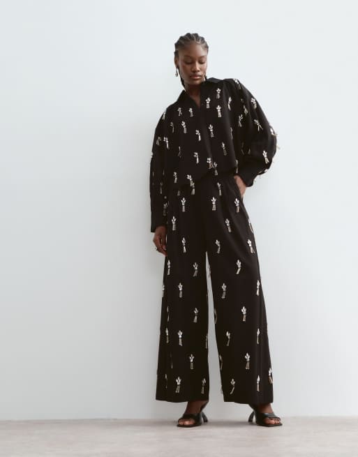 ARRANGE oversized embellished shirt and wide leg pleated pants set in black, 3 of 3