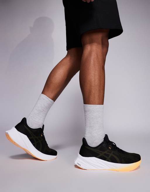 Asics Dynablast 5 running trainers in black and orange fade, 3 of 5