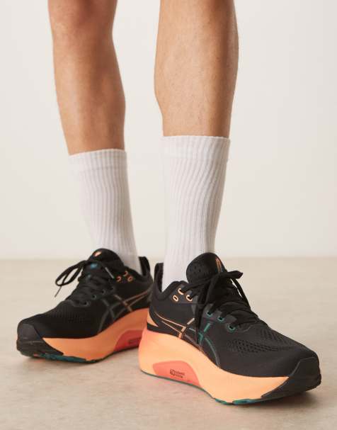 Asics Gel-Kayano 31 running trainers in black and rainy lake - view 1