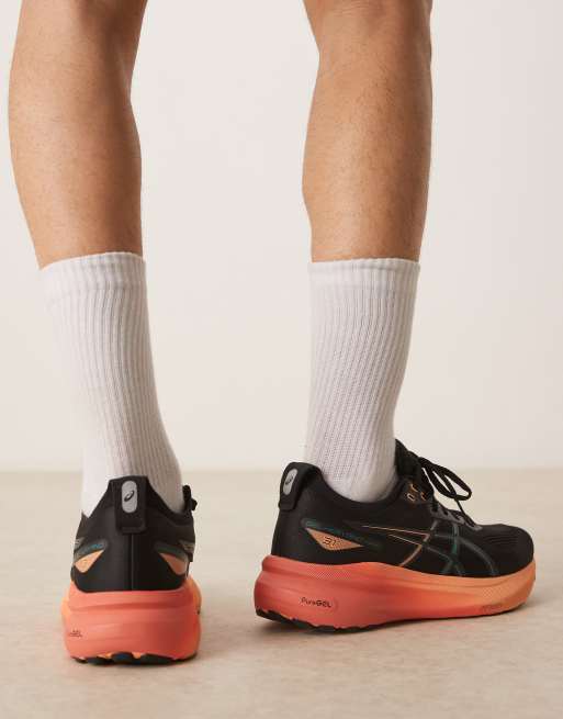 Asics Gel-Kayano 31 running trainers in black and rainy lake, 4 of 5