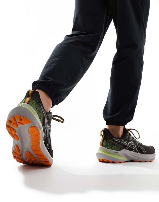 Asics GT 2000 12 TR Stability Sneakers da corsa nere e arancioni ASOS